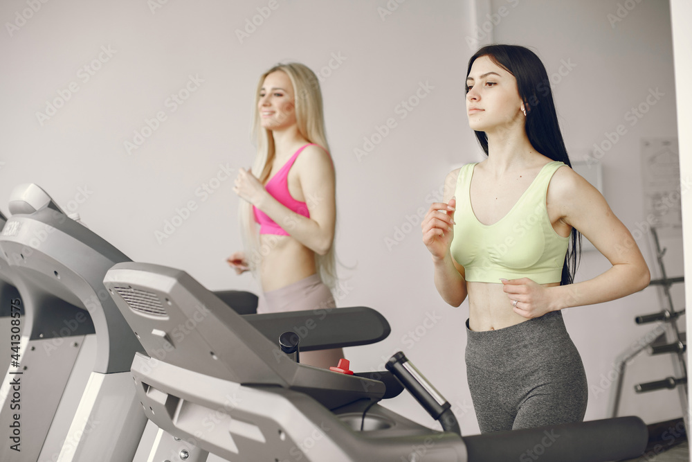 Girls train in gym in sports uniform Girls train in gym in sports uniform