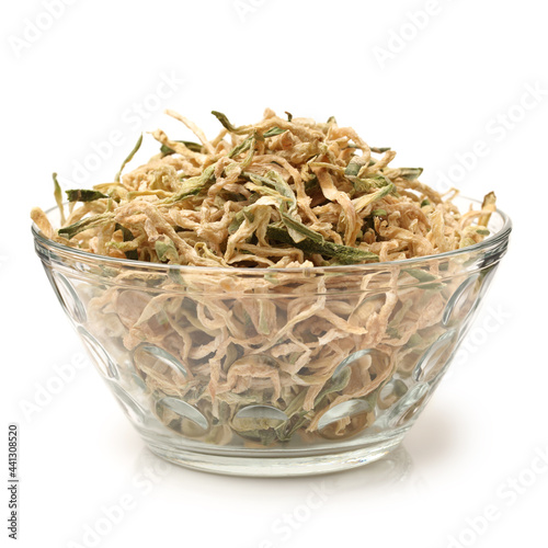 dried green radish slice on white background photo