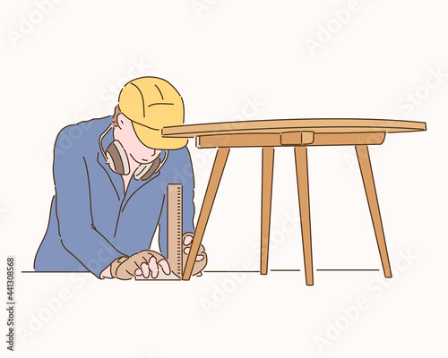 A carpenter is making a table. hand drawn style vector design illustrations. 