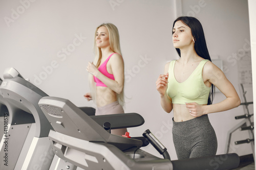 Girls train in gym in sports uniform
