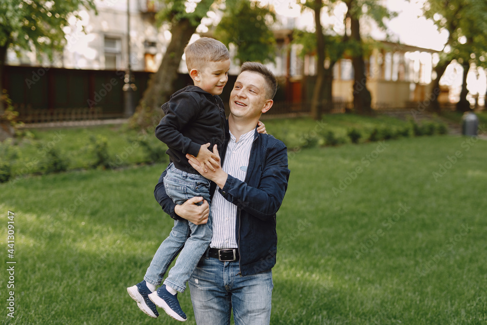 Cute family playing in a summer park Cute family playing in a summer park