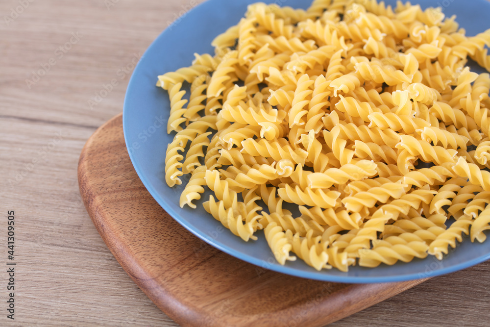 Whole wheat uncooked spaghetti on a plate Whole wheat uncooked spaghetti on a plate