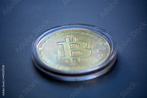 bitcoin gold coin in a transparent case