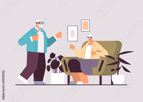 senior couple wearing vr headset grandparents in digital glasses exploring virtual reality interactive services active old age