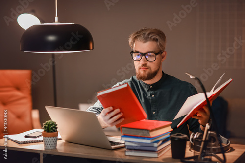 Young man studying online a...