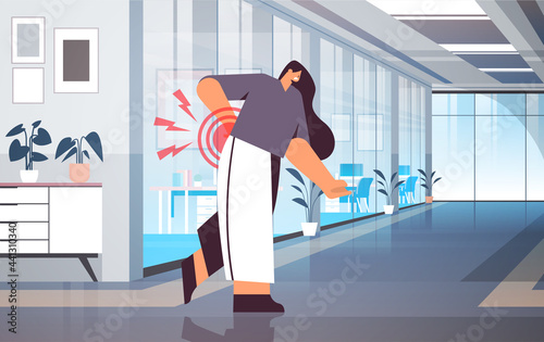 businesswoman suffering from back pain inflammation of muscles concept painful inflamed area highlighted in red