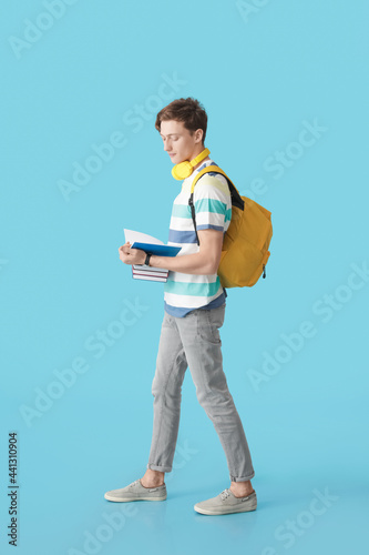 Male student with books on ...