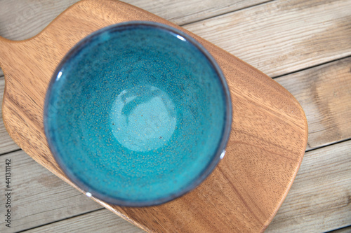 An empty bowl on a cutting board