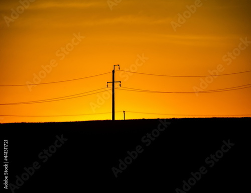 landscape power line on the background of the sunset sky