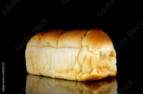 loaf of bread on black background