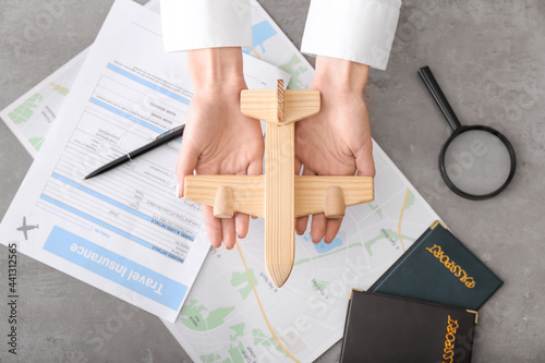 Woman with wooden plane and...