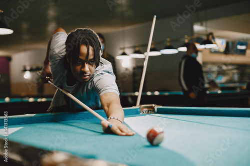 Canvas Print Man playing billiards in a club