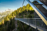 Suspension bridge on Bisse du Ro walking trail near Crans Montana in canton of Valais
