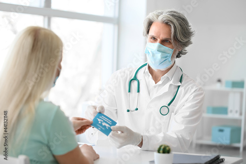 Doctor giving patient her i...