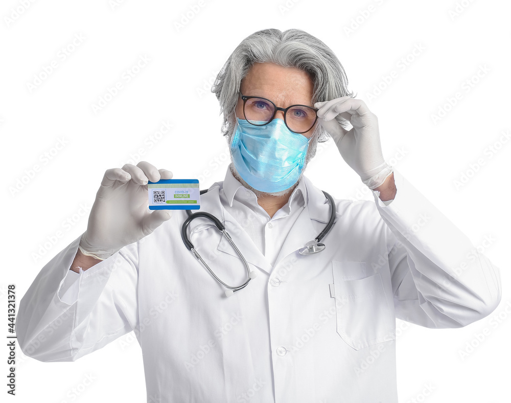 Doctor with vaccination card on white background