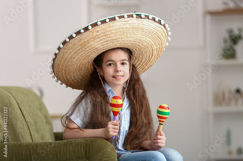 Cute Mexican girl in sombre...