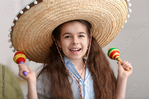 Cute Mexican girl in sombre...