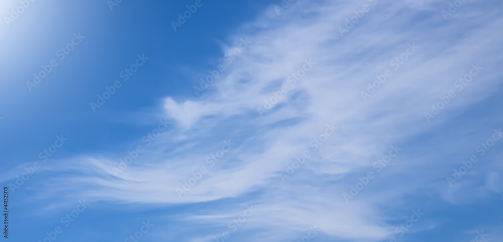 SUMEDANG, INDONESIA - June 13, 2021: Thin clouds under the sun and blue sky. SUMEDANG, INDONESIA - June 13, 2021: Thin clouds under the sun and blue sky.