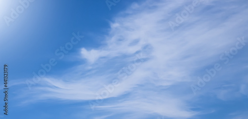 SUMEDANG, INDONESIA - June 13, 2021: Thin clouds under the sun and blue sky.