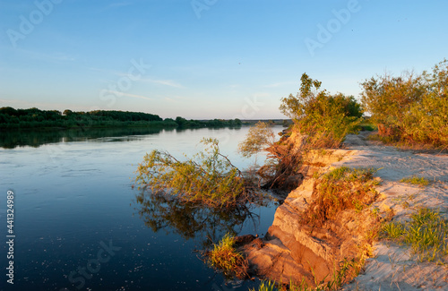 The current of the river destroys the sandy shores. Oka River, Ryazan region, Russia.