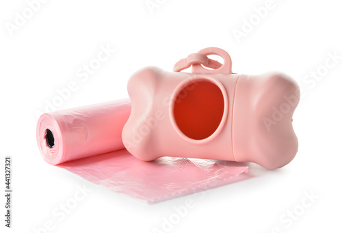 Dispenser with pet waste bags on white background