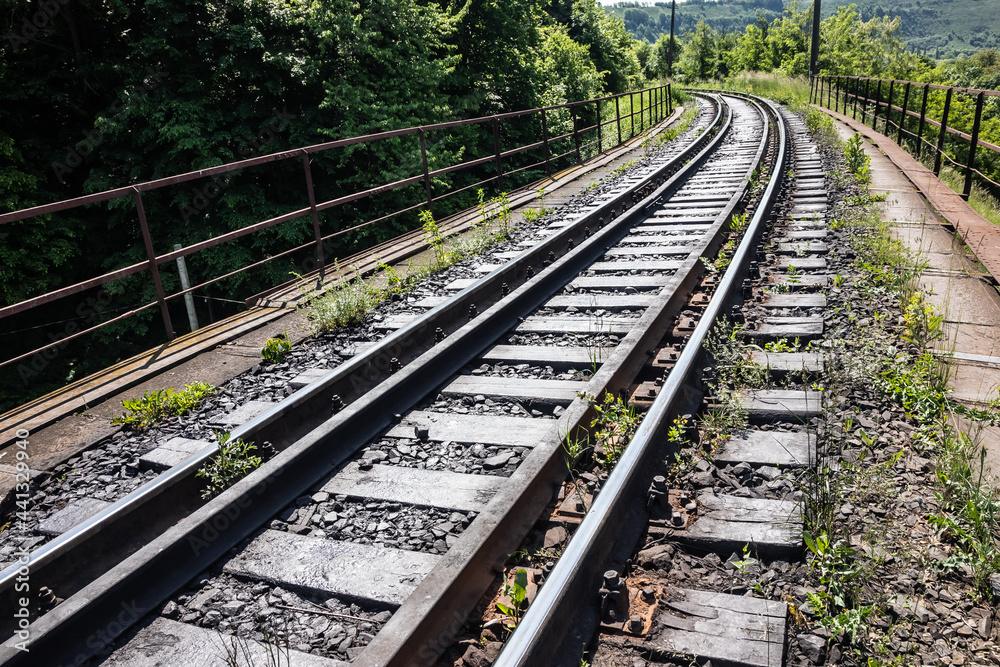 railway tracks on which trains run on a summer day. travel and transportation