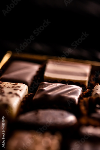 Swiss chocolates in gift box, various luxury pralines made of dark and milk organic chocolate in chocolaterie in Switzerland, sweet dessert food as holiday present and premium confectionery brand. photo