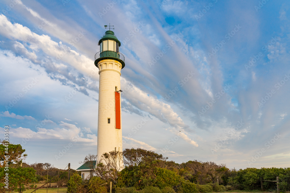 Unusual cloud formation over a tall lighthouse Unusual cloud formation over a tall lighthouse