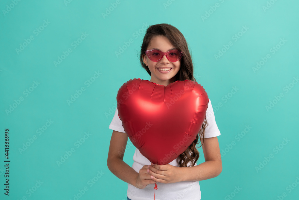 happy child in sunglasses hold red heart party balloon for valentines day love symbol, party happy child in sunglasses hold red heart party balloon for valentines day love symbol, party
