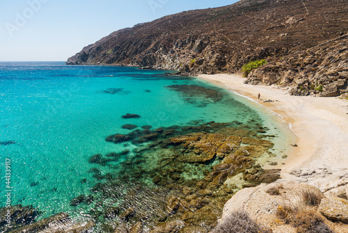 Fototapeta Naklejka Na Ścianę i Meble -  Beach and transparent turquoise sea on the southern coast of the Greek island of Mikonos in the Cyclades archipelago