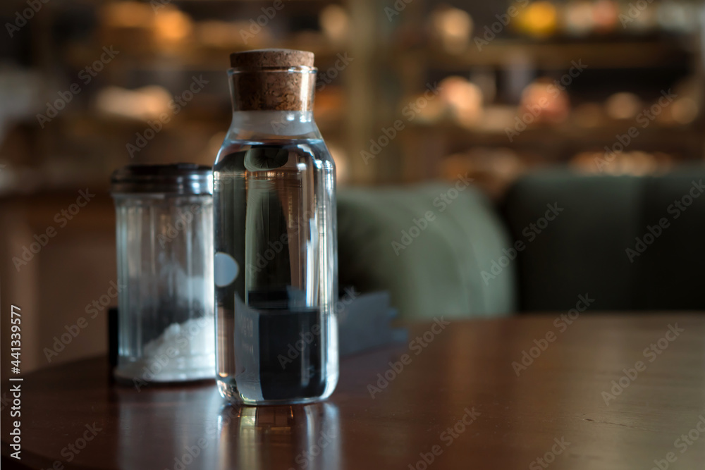 bottle of still water on table in cafe bottle of still water on table in cafe