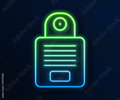 Glowing neon line Intercom icon isolated on blue background. Vector