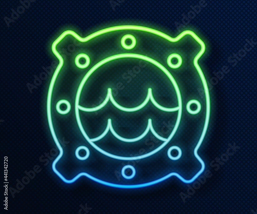 Glowing neon line Ship porthole with rivets and seascape outside icon isolated on blue background. Vector