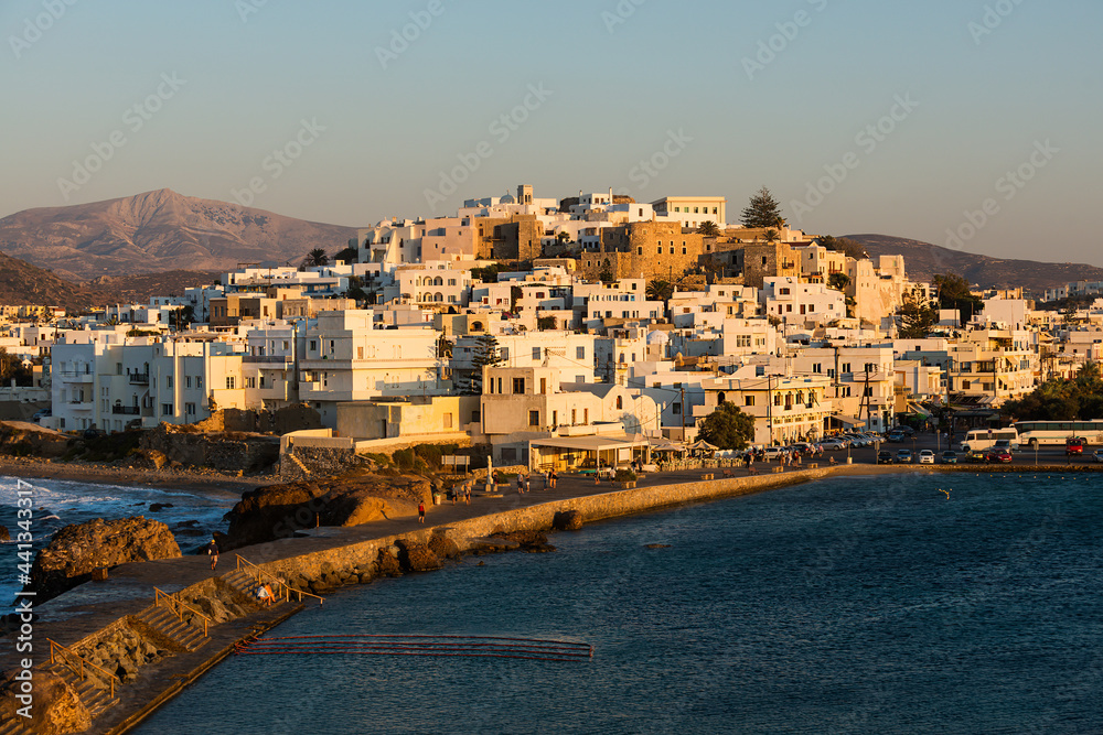 Obraz premium View at sunset of the Port of Naxos on the west coast of the Greek island of the same name in the Cyclades archipelago
