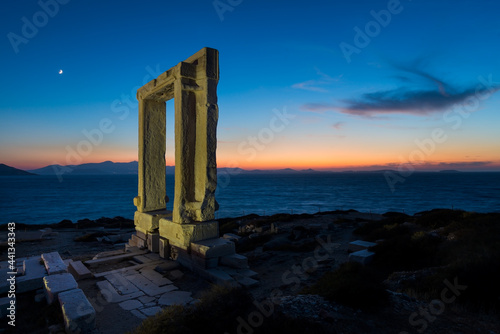 Portara, ruins of the gate of an ancient temple standing on a panoramic point above the town of Naxos on the northwest coast of the Greek island of the same name in the Cyclades