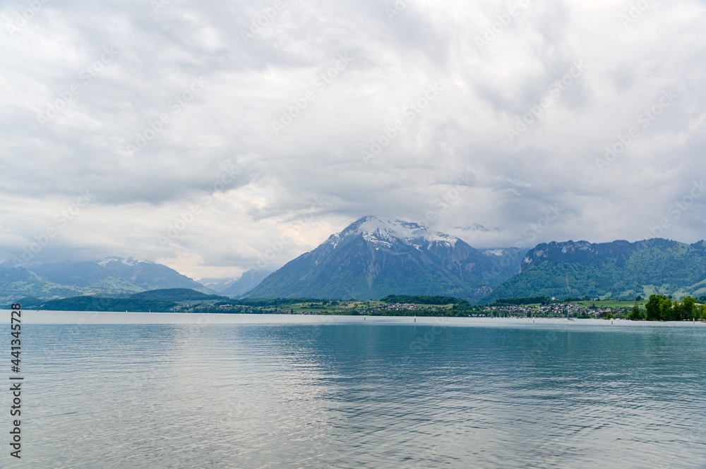 Amazing postcard view on Thun Lake (Thunersee, Thuner See), alps mountains Niesen Thun, Switzerland
