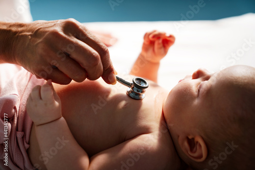 Pediatric doctor exams little baby. Health care, medical examination, people concept © NDABCREATIVITY