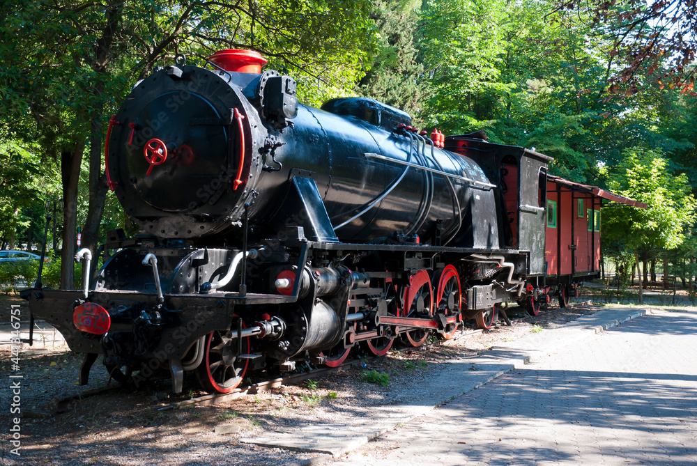 Obraz premium Tripoli, Peloponnese, Greece - June 24, 2021: Antique 1800's steam train at Areos park.