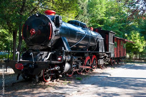 Tripoli, Peloponnese, Greece - June 24, 2021: Antique 1800's steam train at Areos park.