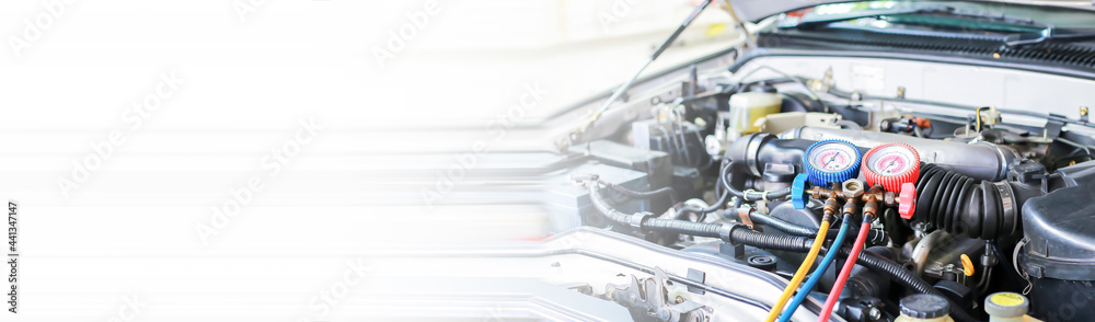 Fototapeta premium Car air conditioner check service, leak detection, fill refrigerant.Device and meter liquid cooling in the car by specialist technicians.