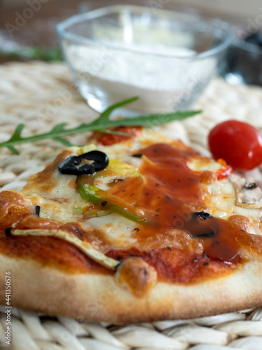 Pizza with fluffy top, tomatoes, olives, green peppers, cheese, fresh from the oven