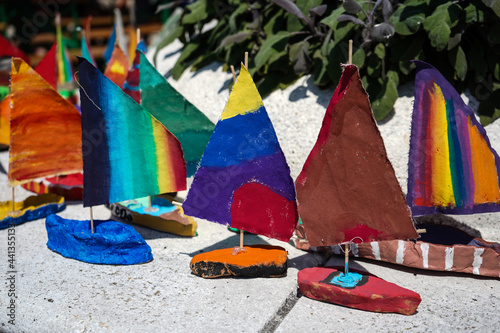 colorful handmade crafted sail boats replicas for playing photo