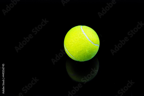 tennis ball isolated on black with reflection © Denis Shmunk