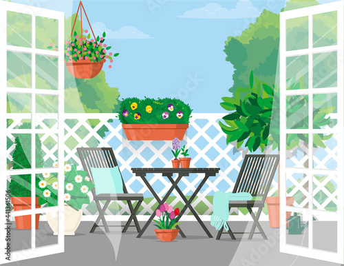 Open doors to the balcony with furniture and green views