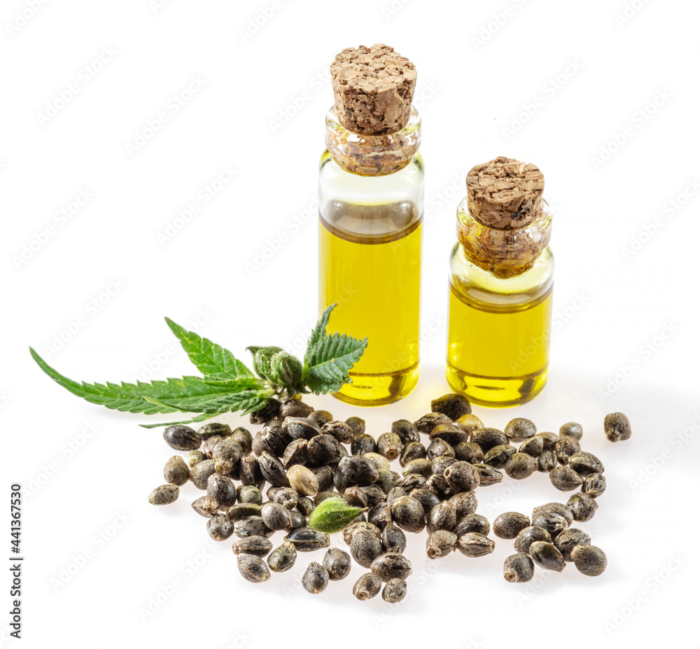 Cannabis seeds and hemp oil isolated on white background. Close up. Cannabis seeds and hemp oil isolated on white background. Close up.