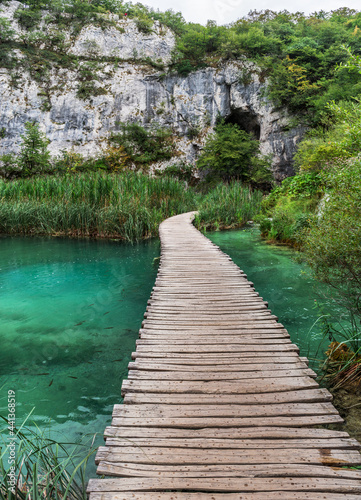 Fototapeta Naklejka Na Ścianę i Meble -  Plitvice Lakes National Park is one of the oldest and largest national parks in Croatia. Lake and walking paths inside the park.