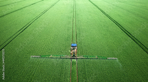 Application of water-soluble fertilizers, pesticides or herbicides in the field. View from the drone.