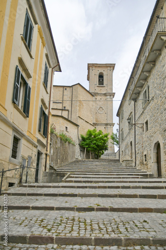 Fototapeta Naklejka Na Ścianę i Meble -  A small street between the old houses of Agnone, a medieval village in the Molise region in Italy.