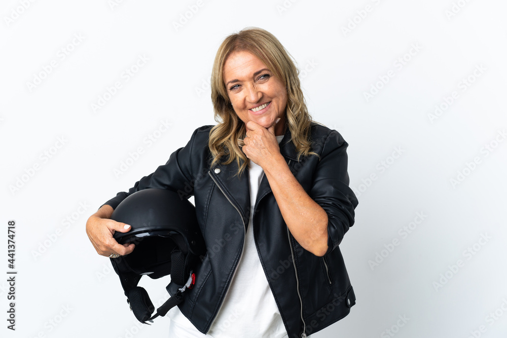 Middle aged biker over isolated white background looking to the side and smiling Middle aged biker over isolated white background looking to the side and smiling