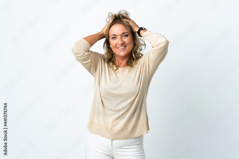 Middle aged blonde woman over isolated white background laughing Middle aged blonde woman over isolated white background laughing
